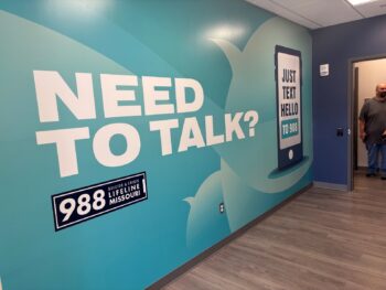 A mural encourages Centerstone clients in crisis to use 988 call, text or chat options. The mural is located at a Centerstone clinic in Marshfield, Missouri.