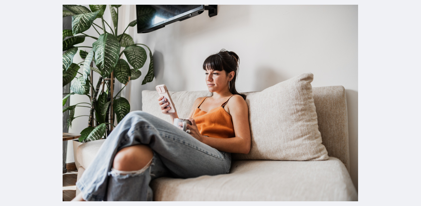 girl on couch on phone