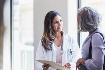 Doctor shares good news with senior patient
