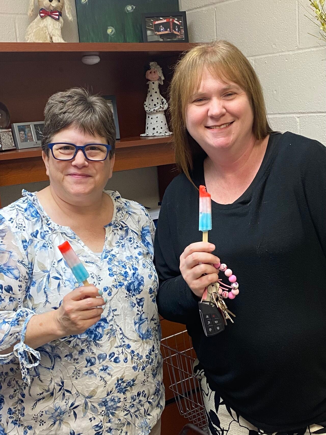 Two smiling Centerstone staff enjoying National Popsicle Day.