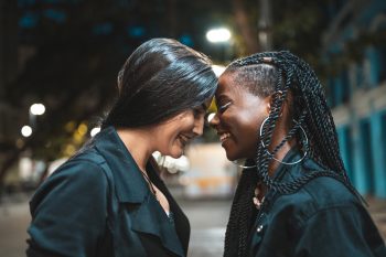 Female friendship outdoors in the night