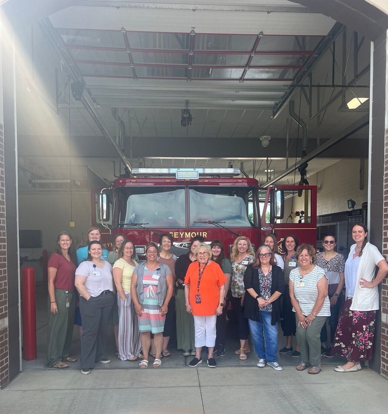 Centerstone staff gathered in front of a fire engine outside the local fire department.