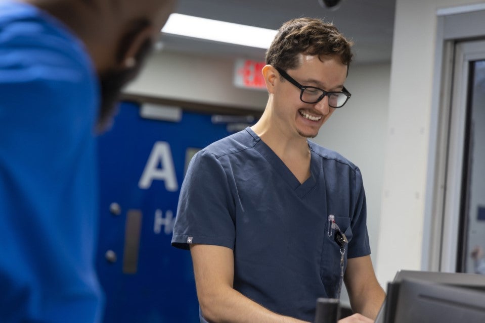 Two behavioral health professionals at Centerstone's hospital smiling while working.