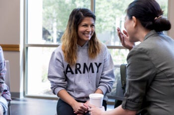 Female army vets share laugh at support group meeting
