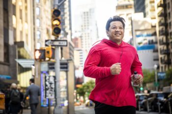 Mature Hispanic Man Running in City