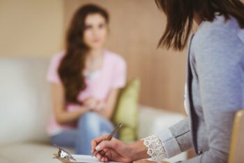 Therapist listening to her patient